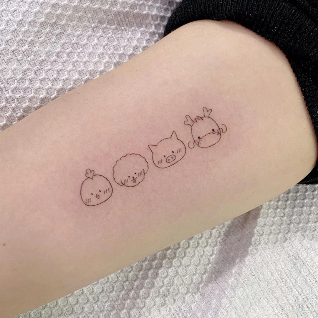 Cute minimalist animal tattoos on a forearm