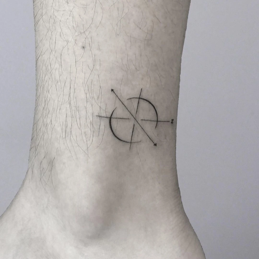 Minimalist tattoo design on ankle featuring geometric shapes.
