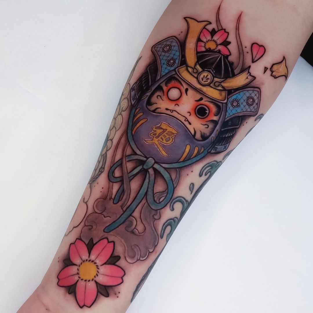 Tattoo of a samurai cat with flowers and vibrant colors